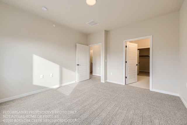 834 W 128th Pl, Westminster, CO 80234 - unfurnished bedroom with a spacious closet, baseboards, visible vents, and carpet