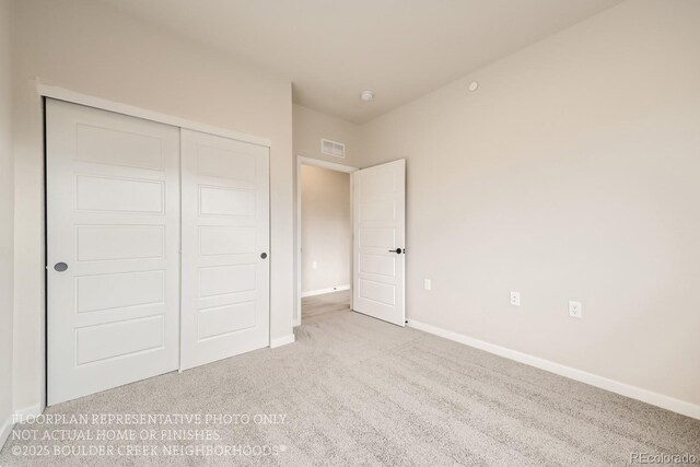 834 W 128th Pl, Westminster, CO 80234 - unfurnished bedroom featuring visible vents, baseboards, carpet flooring, and a closet