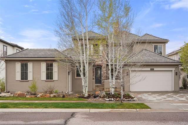 15252 W Warren Dr, Lakewood, CO 80228 - traditional-style home featuring concrete driveway, a garage, and stucco siding