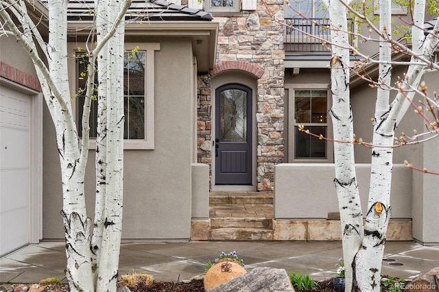 15252 W Warren Dr, Lakewood, CO 80228 - entrance to property featuring stucco siding and stone siding