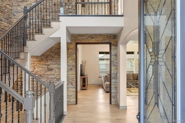 15252 W Warren Dr, Lakewood, CO 80228 - foyer featuring baseboards, a high ceiling, and wood finished floors