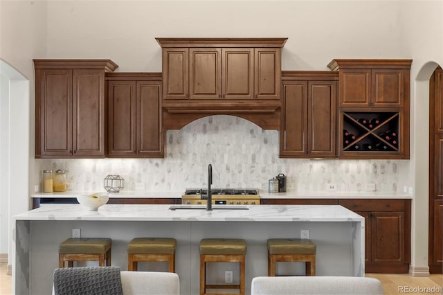 15252 W Warren Dr, Lakewood, CO 80228 - bar with a sink, range hood, and backsplash