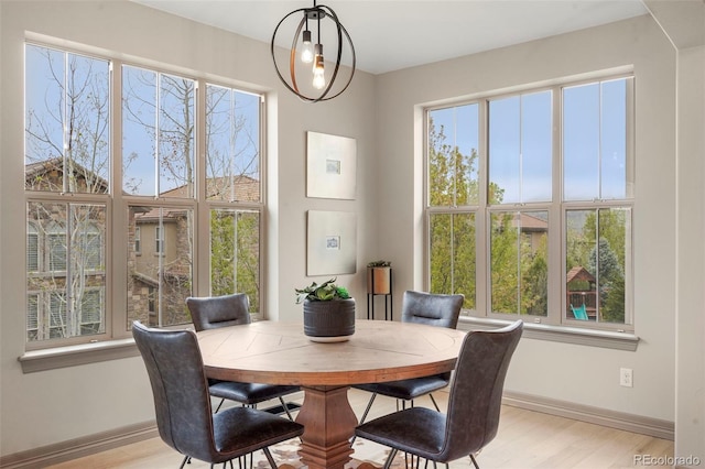 15252 W Warren Dr, Lakewood, CO 80228 - dining space featuring baseboards and light wood-style floors