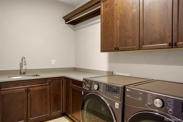 15252 W Warren Dr, Lakewood, CO 80228 - washroom with a sink, cabinet space, and washing machine and clothes dryer
