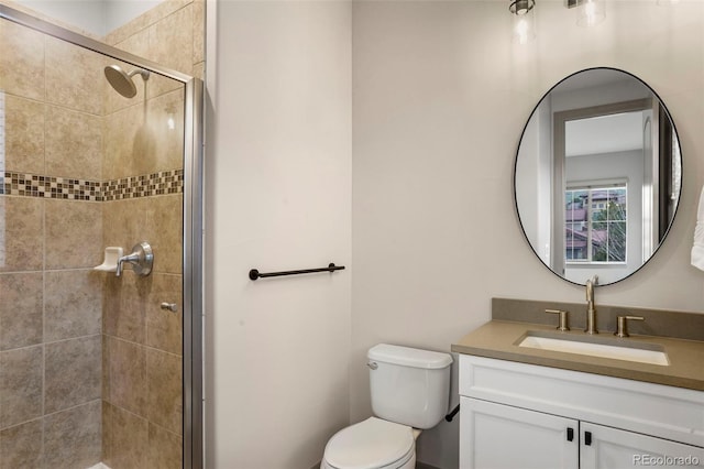 15252 W Warren Dr, Lakewood, CO 80228 - bathroom featuring vanity, toilet, and a stall shower