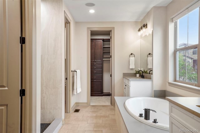 15252 W Warren Dr, Lakewood, CO 80228 - bathroom featuring vanity, recessed lighting, a bath, and visible vents