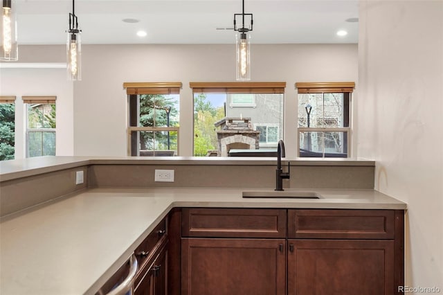 15252 W Warren Dr, Lakewood, CO 80228 - kitchen with recessed lighting, a sink, decorative light fixtures, and light countertops