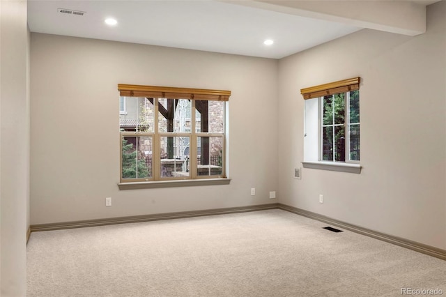 15252 W Warren Dr, Lakewood, CO 80228 - carpeted empty room with visible vents, baseboards, and plenty of natural light