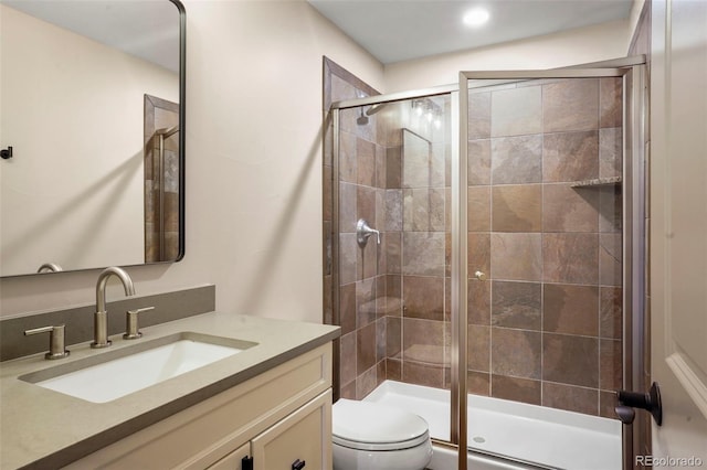 15252 W Warren Dr, Lakewood, CO 80228 - bathroom with vanity, a stall shower, and toilet