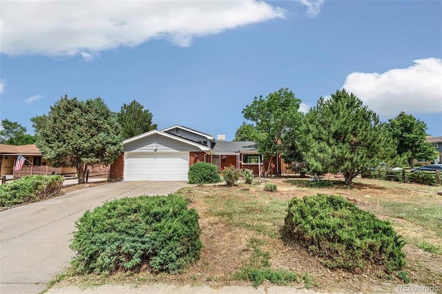 206 Troy St, Aurora, CO 80011 - single story home with an attached garage, driveway, and brick siding
