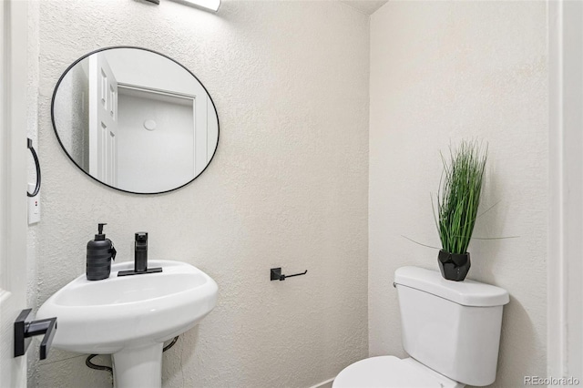 206 Troy St, Aurora, CO 80011 - bathroom featuring toilet and a sink