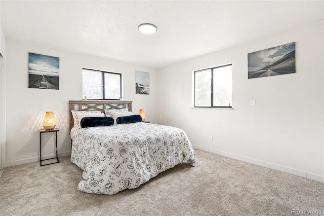 206 Troy St, Aurora, CO 80011 - carpeted bedroom with baseboards