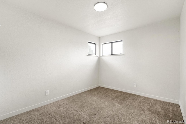 206 Troy St, Aurora, CO 80011 - unfurnished room featuring carpet flooring and baseboards