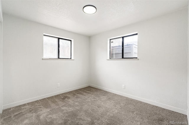 206 Troy St, Aurora, CO 80011 - unfurnished room with carpet floors and baseboards