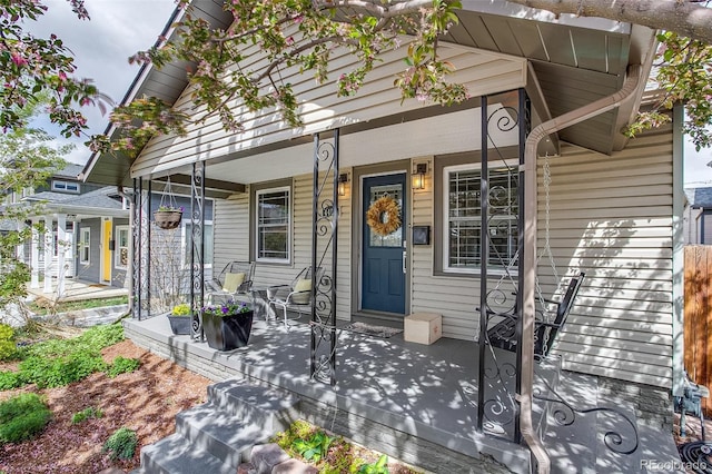 doorway to property with a porch