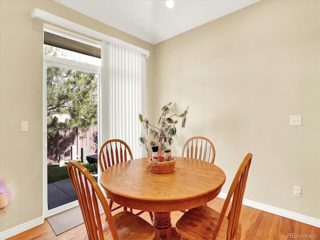 11556 W Cooper Pl, Littleton, CO 80127 - dining area featuring baseboards and light wood finished floors