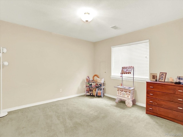 11556 W Cooper Pl, Littleton, CO 80127 - recreation room with light colored carpet and baseboards