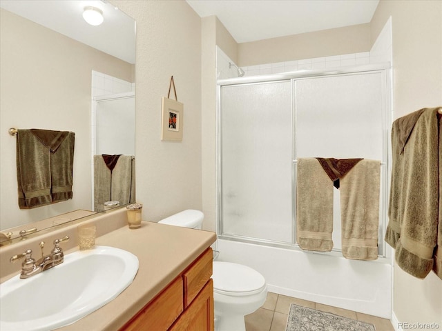 11556 W Cooper Pl, Littleton, CO 80127 - bathroom featuring vanity, tile patterned floors, and enclosed tub / shower combo
