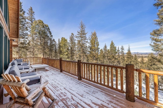 view of snow covered deck