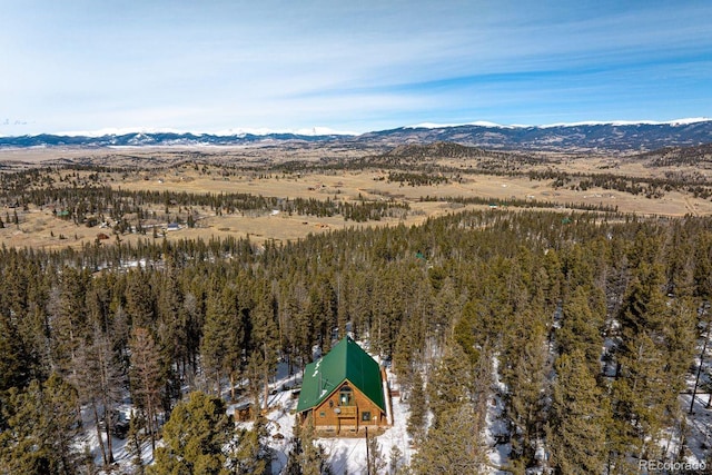 aerial view with a forest view and a mountain view