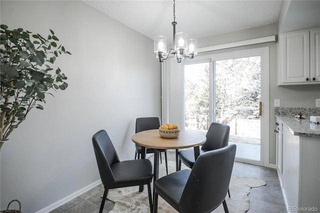 dining space featuring a chandelier