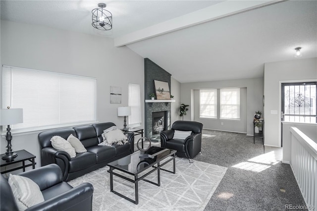 carpeted living room with vaulted ceiling with beams and a fireplace