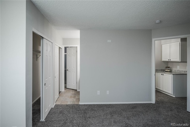 interior space featuring a textured ceiling