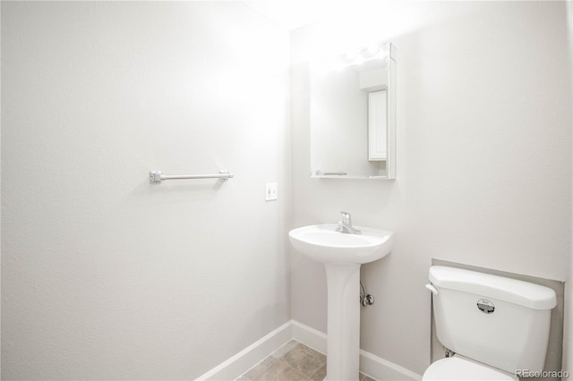 bathroom with sink and toilet