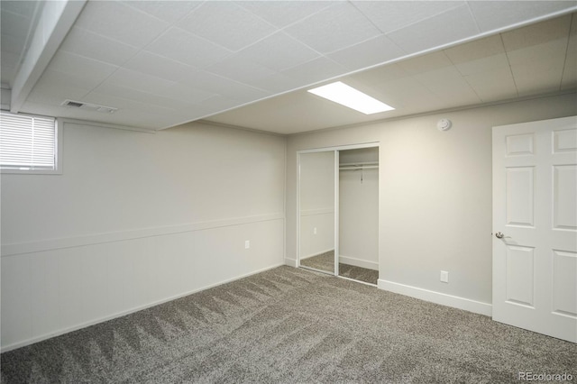 unfurnished bedroom with carpet flooring and a closet