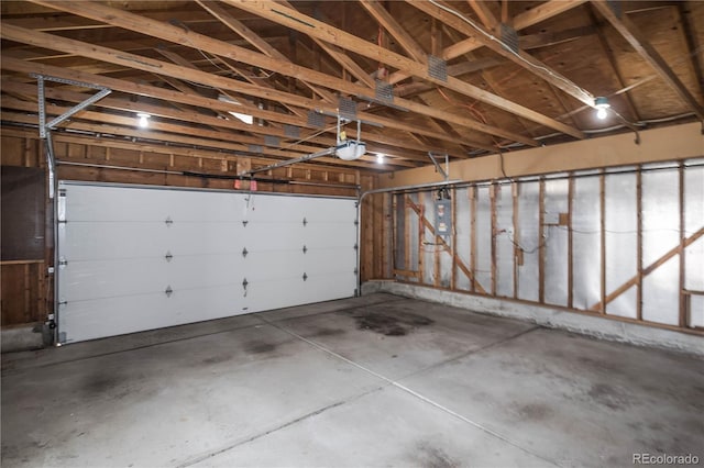 garage featuring a garage door opener and electric panel