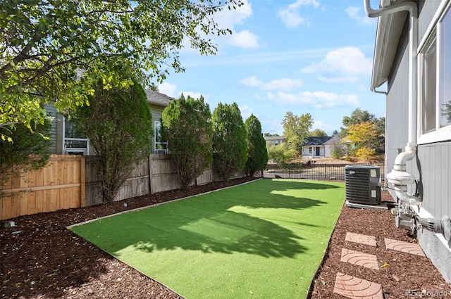 view of yard featuring central AC unit