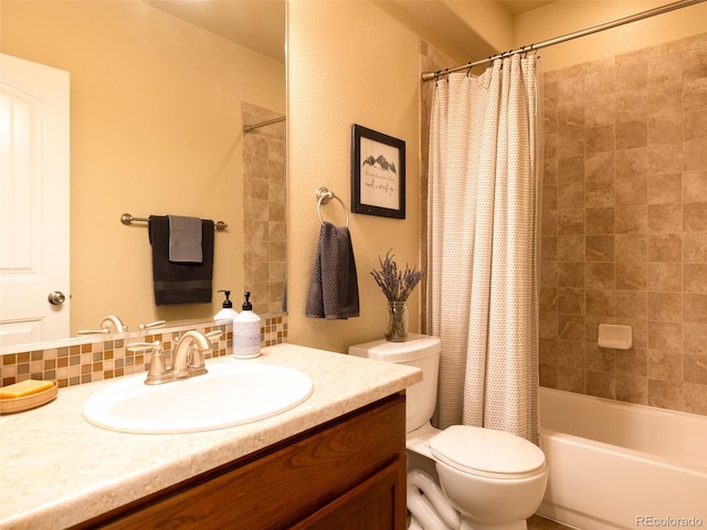 bathroom with vanity, shower / bath combination with curtain, and toilet