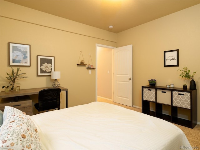 bedroom with baseboards and carpet