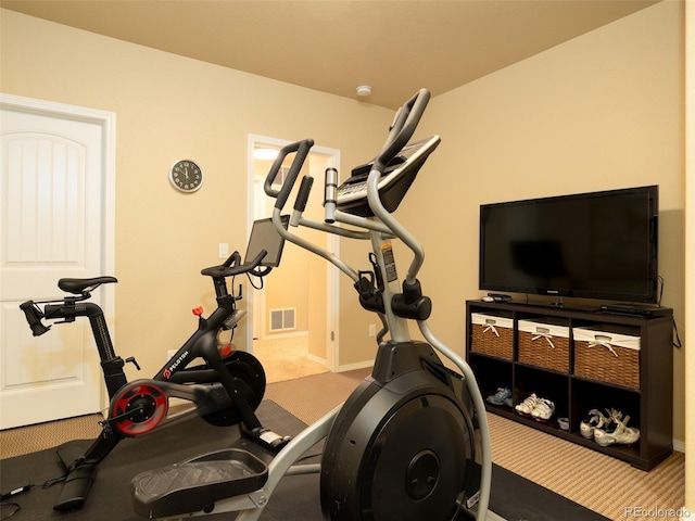 workout area with carpet flooring, baseboards, and visible vents