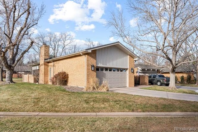 view of side of property with a garage and a lawn