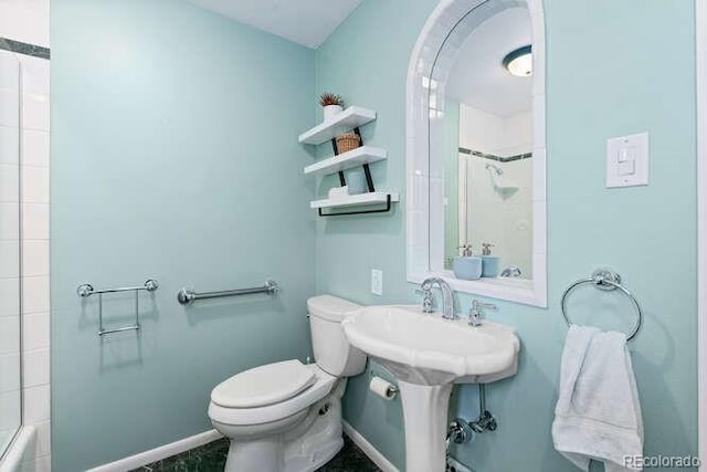 bathroom with shower / washtub combination and toilet