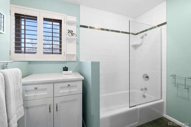 bathroom with vanity and  shower combination