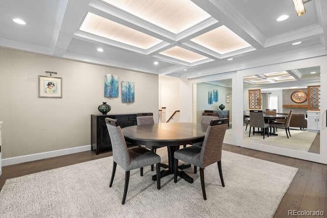 dining room featuring beamed ceiling and coffered ceiling