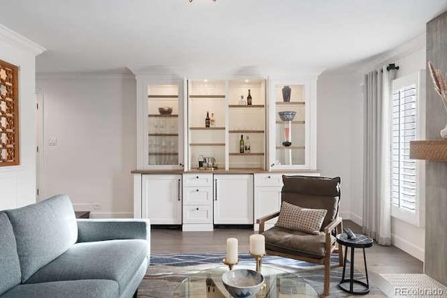 bar featuring refrigerator, dark hardwood / wood-style floors, white cabinetry, and ornamental molding