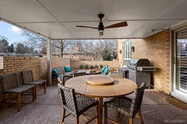 view of patio / terrace with grilling area and ceiling fan