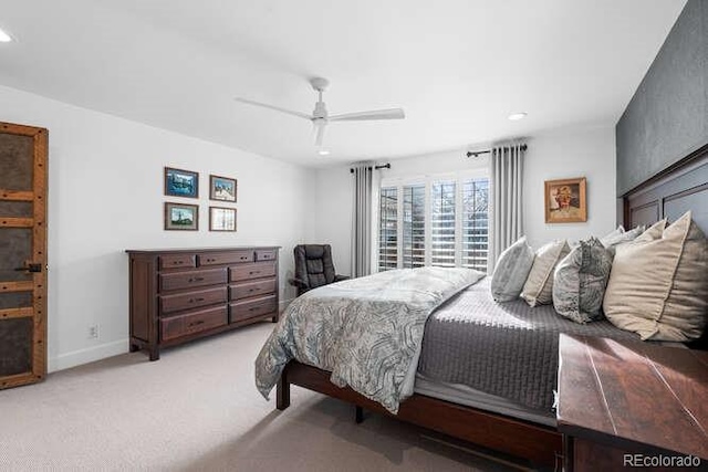 bedroom featuring ceiling fan and light carpet