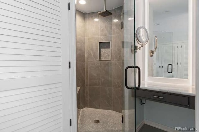 bathroom with vanity and walk in shower