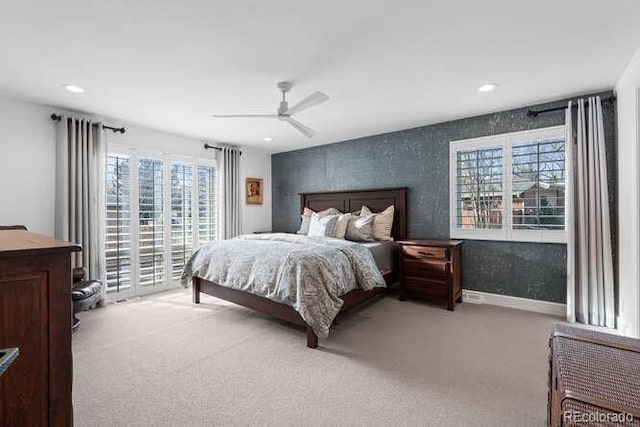 bedroom featuring ceiling fan and light colored carpet