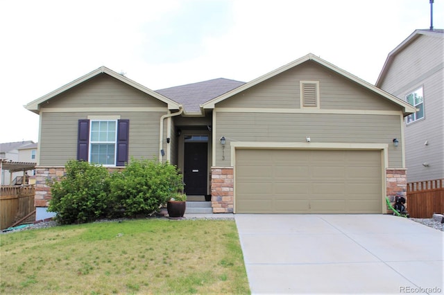 713 Indigo St, Brighton, CO 80603 - view of front of property featuring stone siding, driveway, and an attached garage