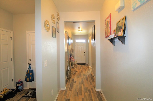 713 Indigo St, Brighton, CO 80603 - hall featuring wood finished floors and baseboards