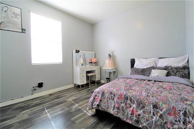 713 Indigo St, Brighton, CO 80603 - bedroom featuring wood finished floors and baseboards