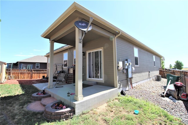 713 Indigo St, Brighton, CO 80603 - rear view of house featuring a fenced backyard and a patio