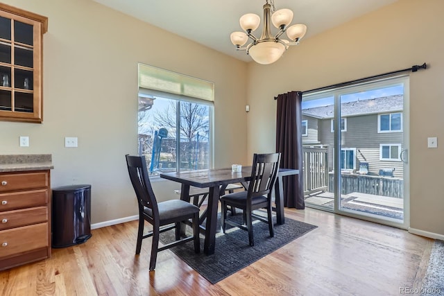 10117 Waco St, Commerce City, CO 80022 - dining space featuring a chandelier and light wood-type flooring