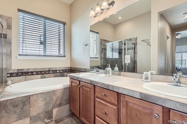 10117 Waco St, Commerce City, CO 80022 - full bathroom with a stall shower, a bath, and double vanity