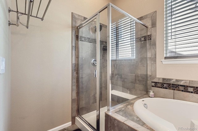 10117 Waco St, Commerce City, CO 80022 - bathroom featuring a bath, healthy amount of natural light, and a stall shower
